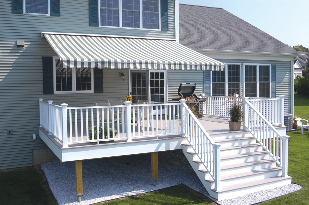 Modern home featuring a motorized awning designed for shade, heat reduction, and everyday outdoor enjoyment.