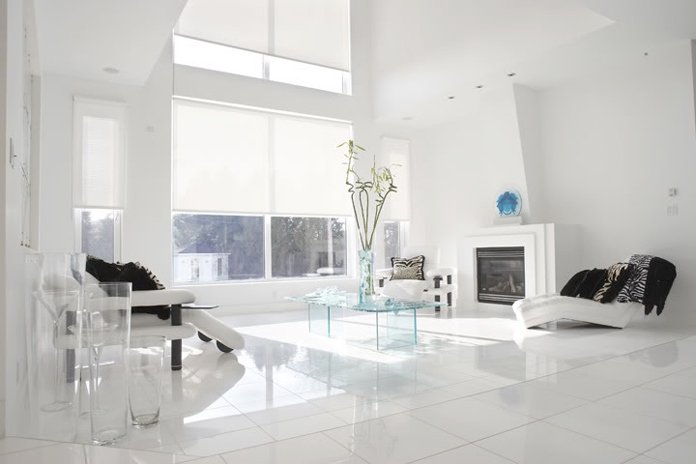 Modern light filtering roller shade on a window, allowing soft natural light to filter in while maintaining privacy and enhancing room ambiance.