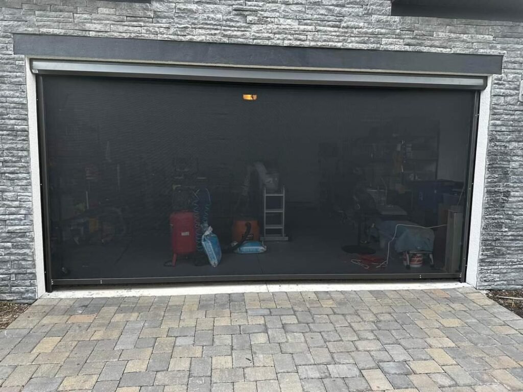 Roll-up garage screen transforms your garage into a breezy, insect-free space with flexible access and ventilation
