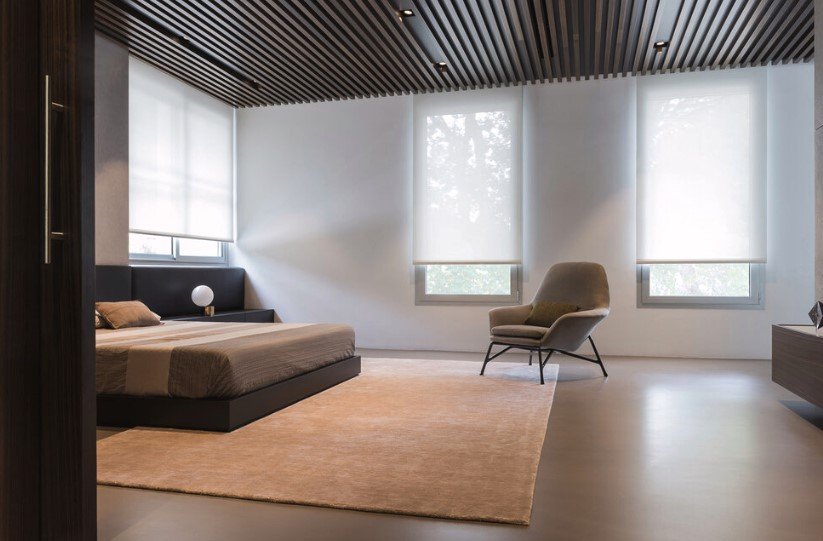 Stylish solar shade installed on a window, providing UV protection and reducing glare while allowing natural light to filter through