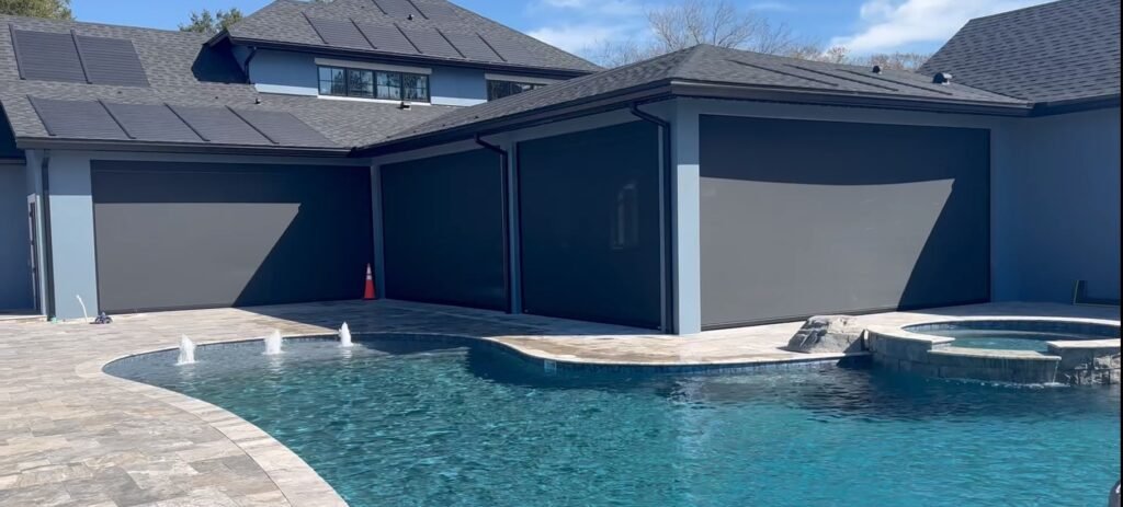 Effortless shade solution with motorized screens, for an outdoor kitchen blending style and convenience for your outdoor living