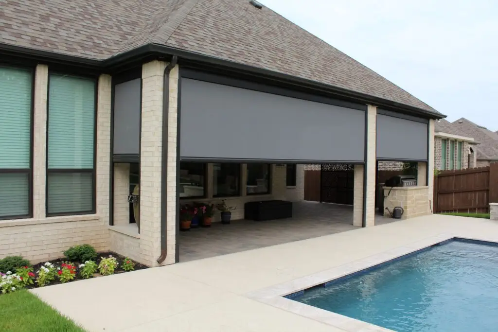 Progressive MagnaTrack motorized privacy screen enclosing a patio for comfort and seclusion in a Florida home.