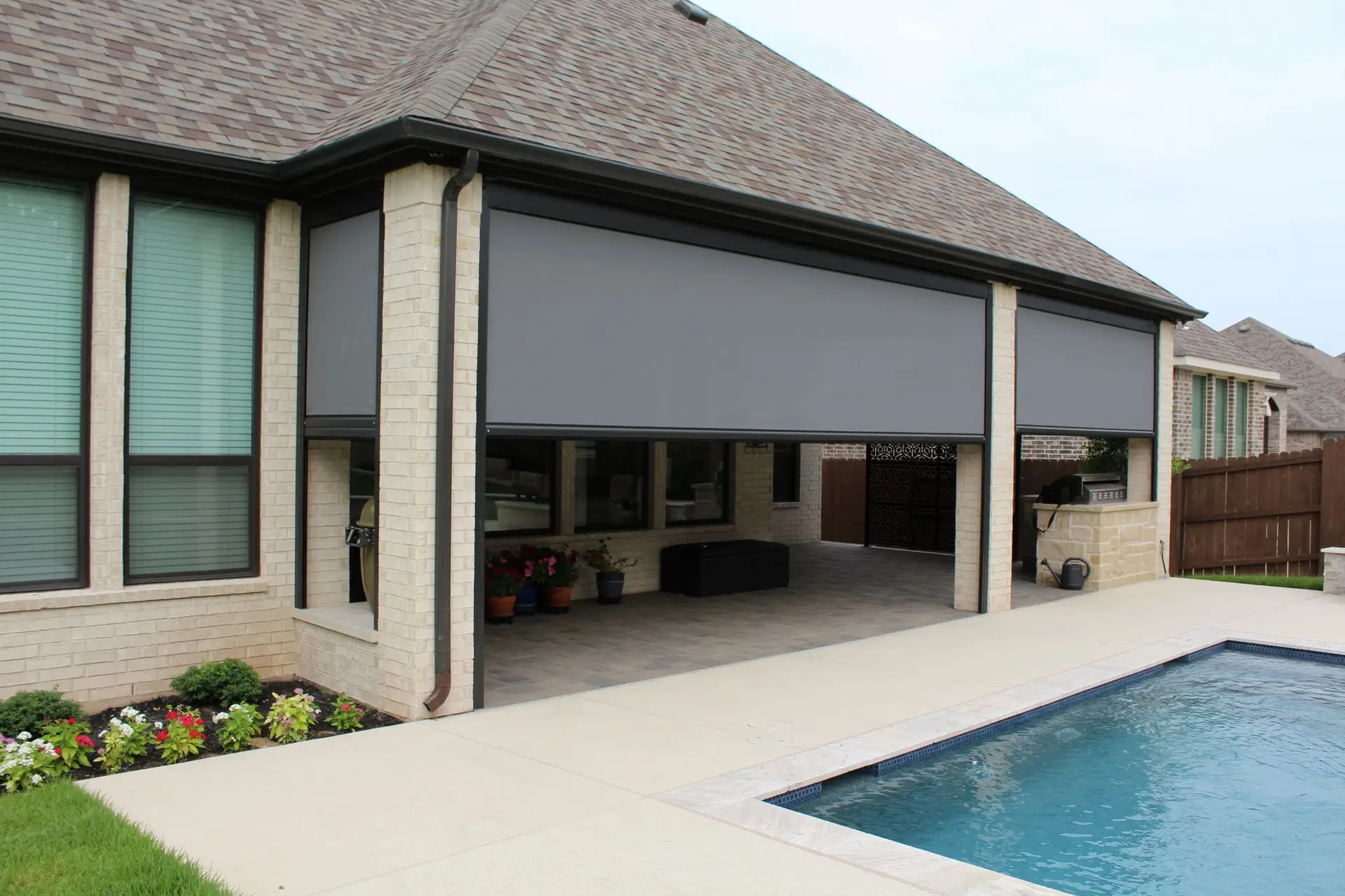 Progressive MagnaTrack motorized privacy screen enclosing a patio for comfort and seclusion in a Florida home.