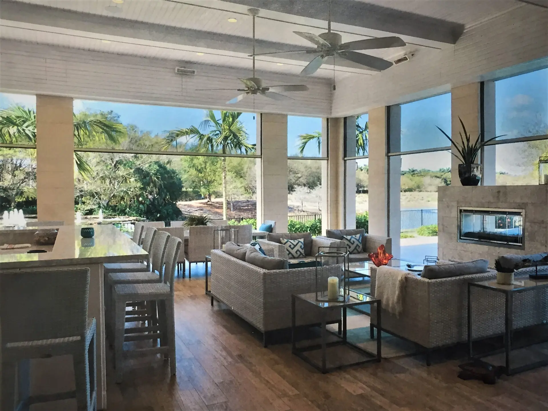 Progressive MagnaTrack motorized lanai screens providing shade and comfort for a Florida home patio.