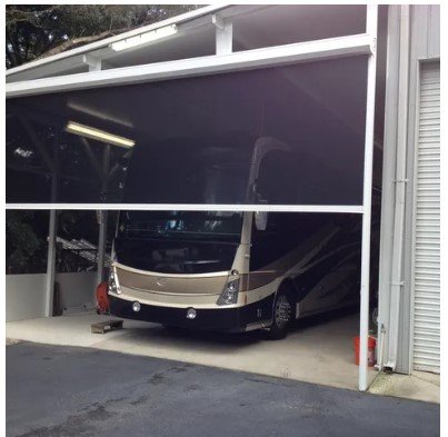 Motorized screen for camper or rv garage
