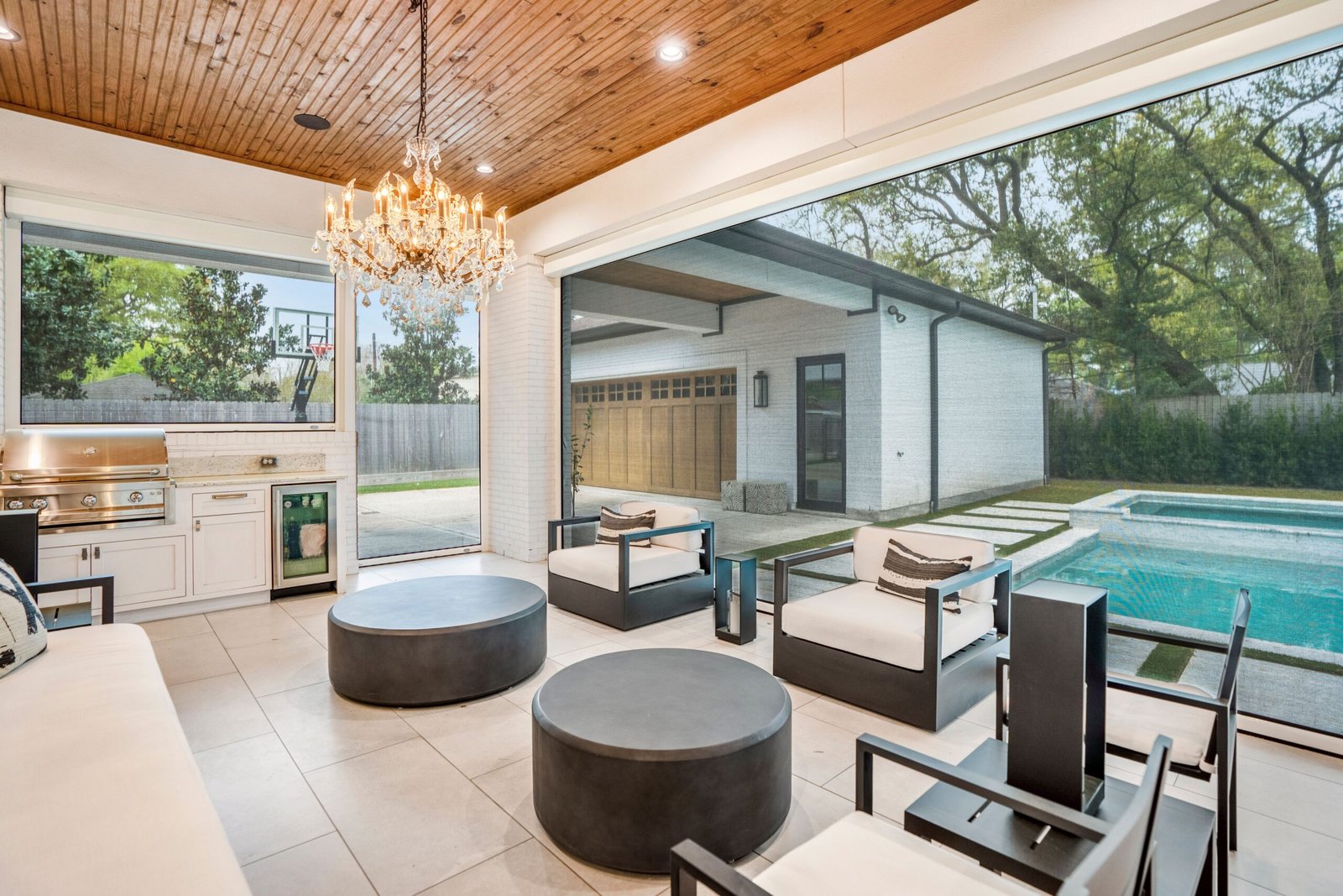 Progressive MagnaTrack retractable screen system with patented magnetic side tracks and motorized operation.