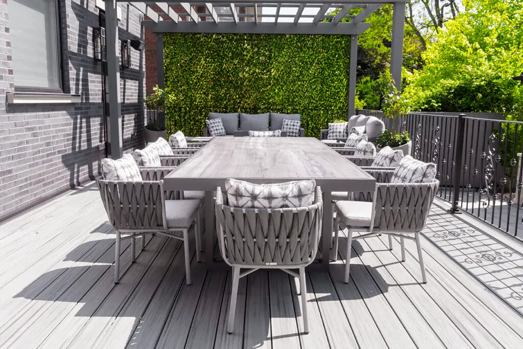 Commercial-grade outdoor furniture arranged in a resort-style setting with coordinated colors and textures.