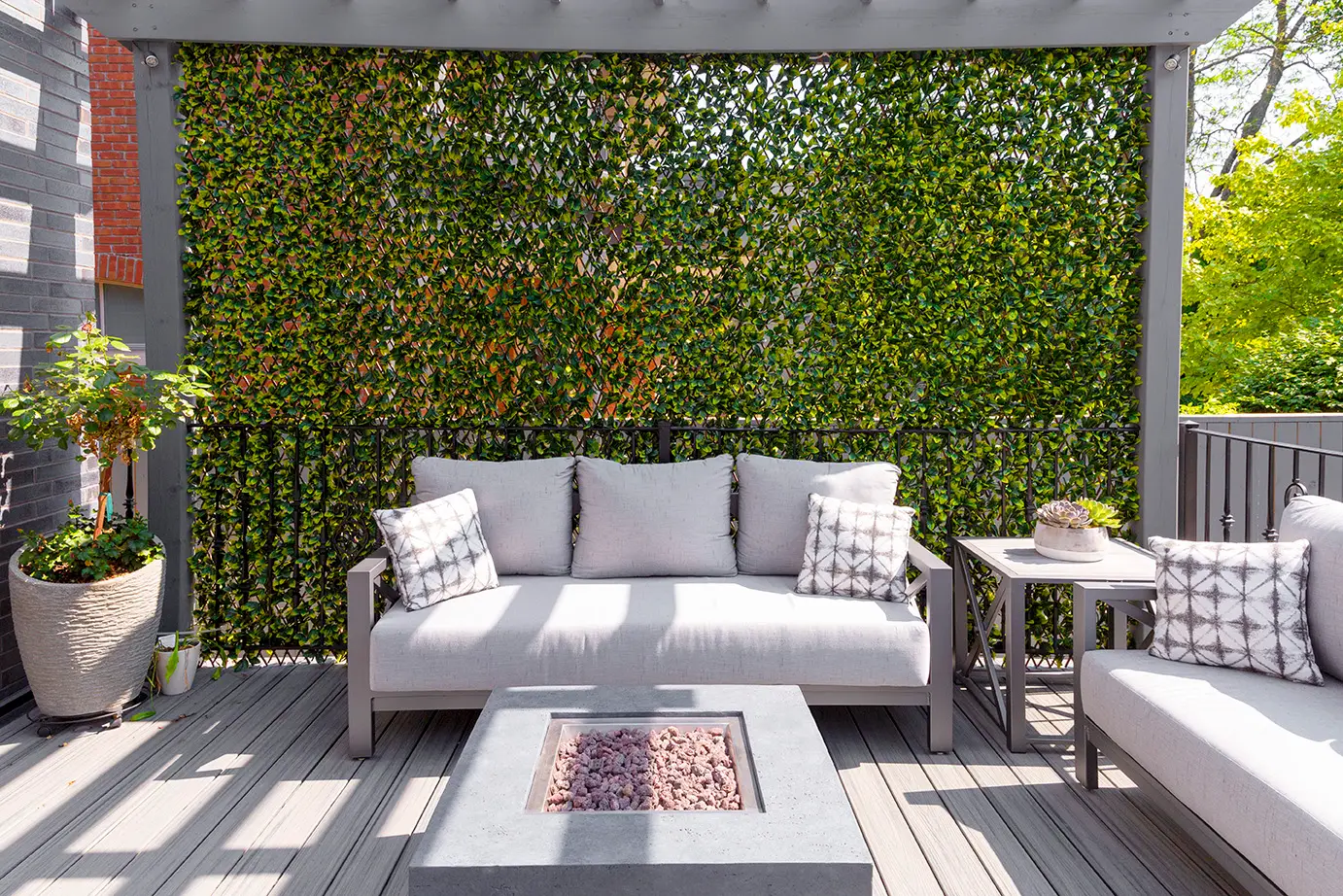 Sleek outdoor furniture set with modular seating and neutral tones arranged on a contemporary patio.