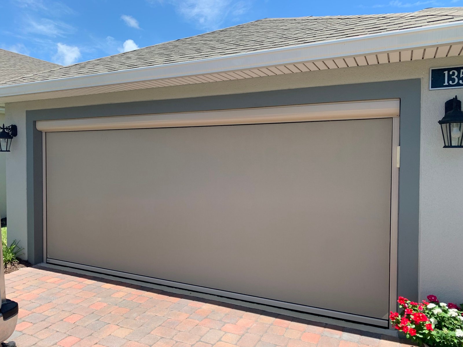 Motorized garage door screen with remote for bug protection