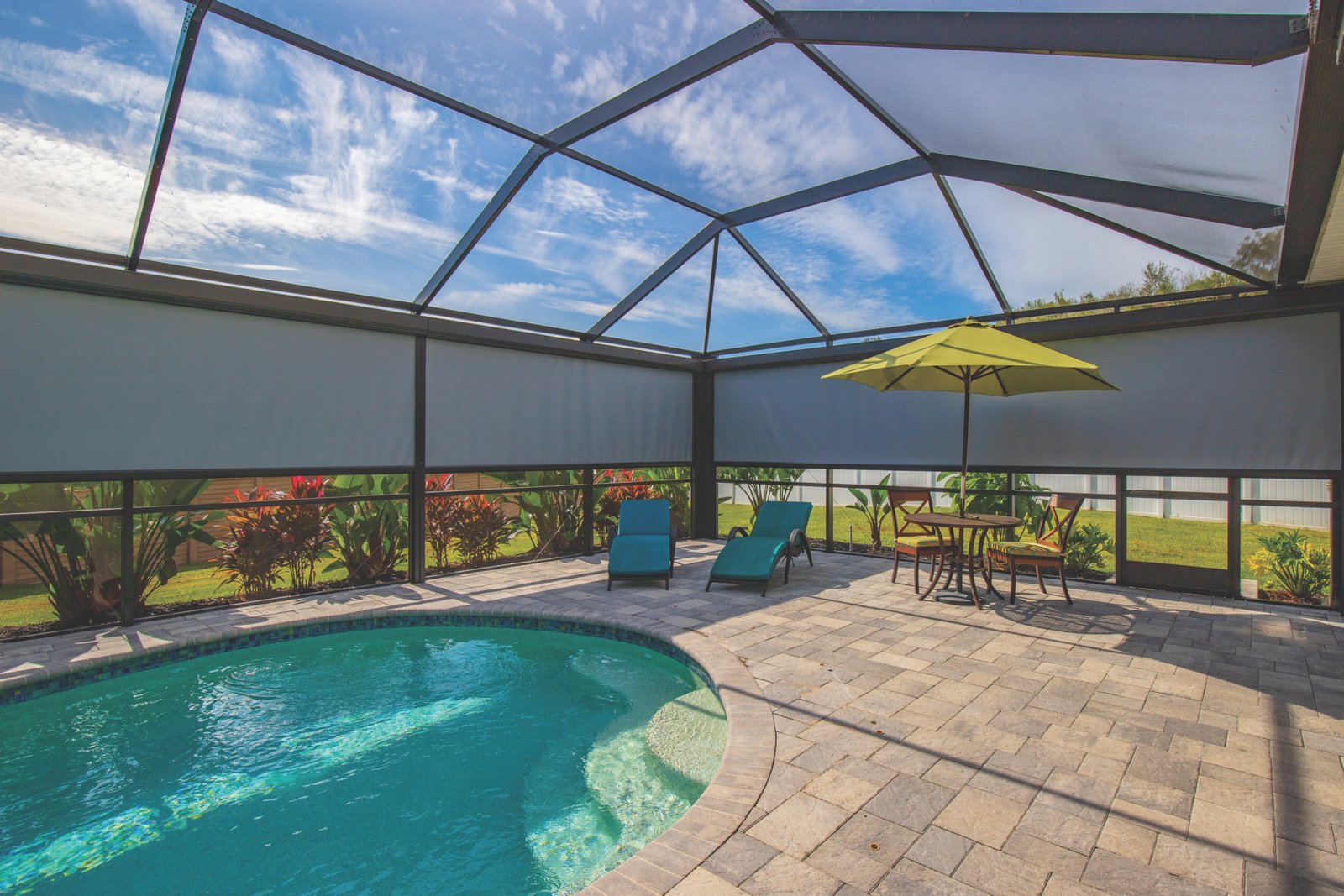 Give your pool area privacy with a motorized screen