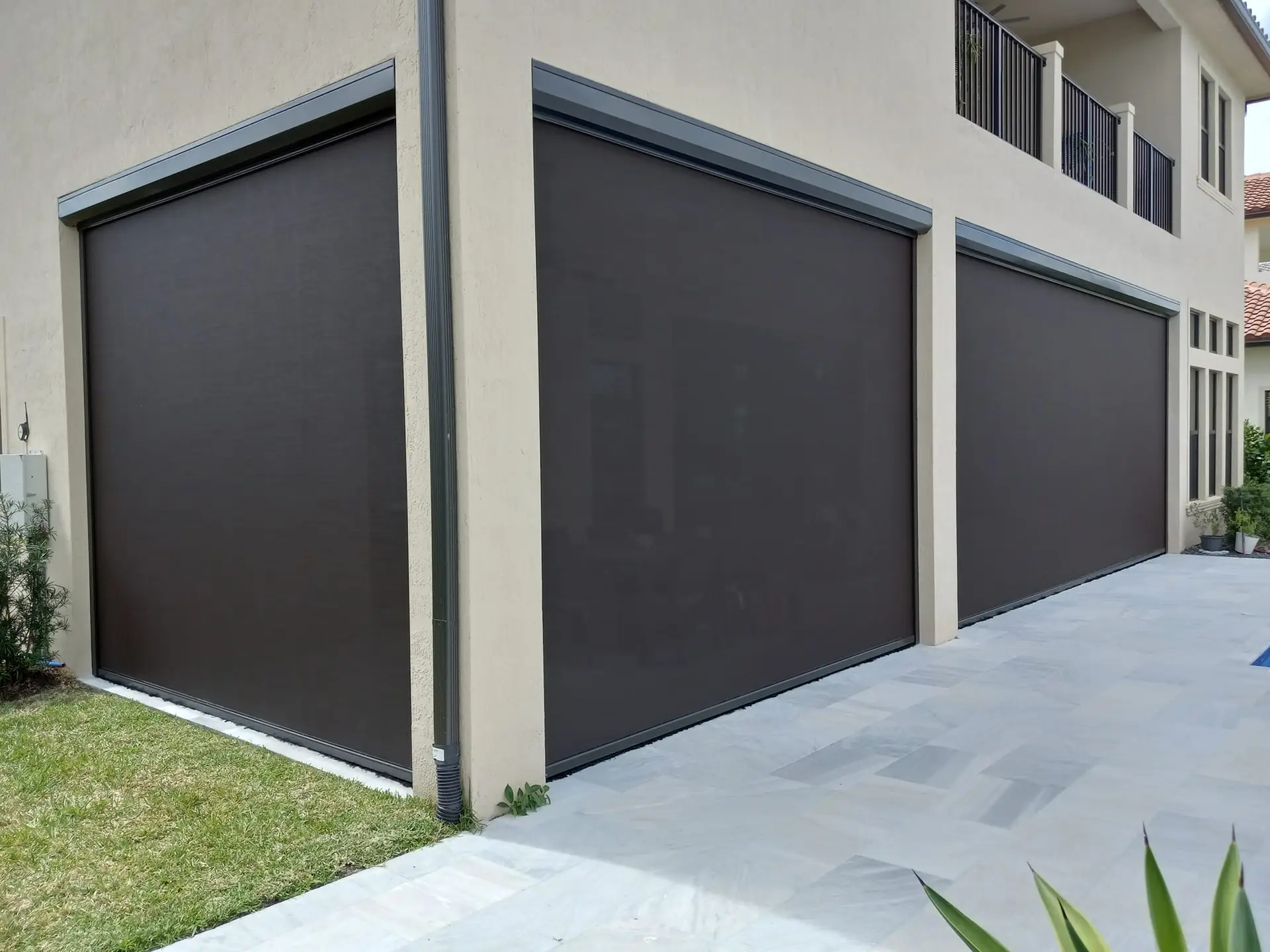 Motorized lanai screens create a cleaner, cooler, more usable outdoor area with push-button convenience.