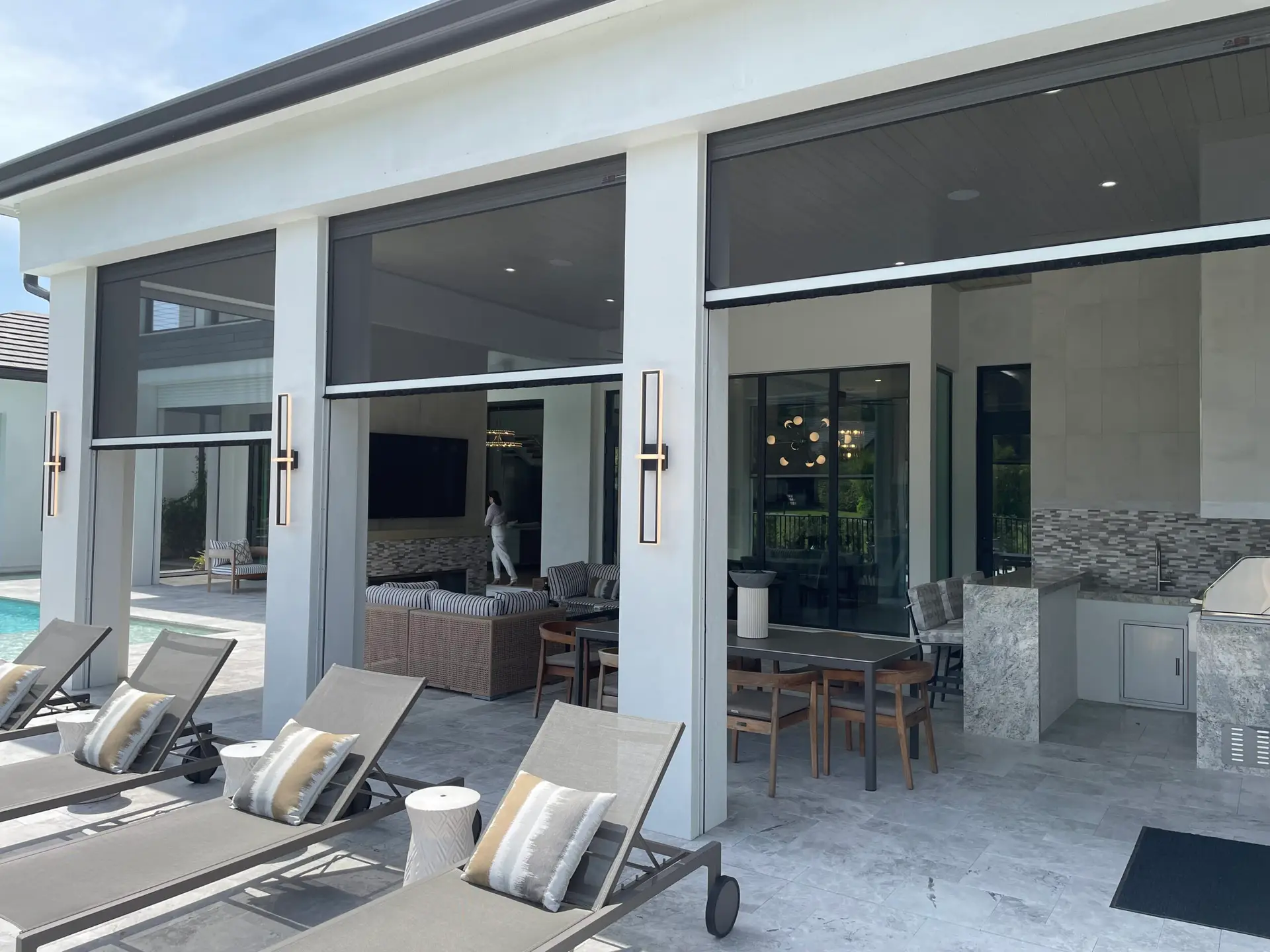 Retractable lanai screens help turn open outdoor spaces into relaxing areas for dining, entertaining, and family time.