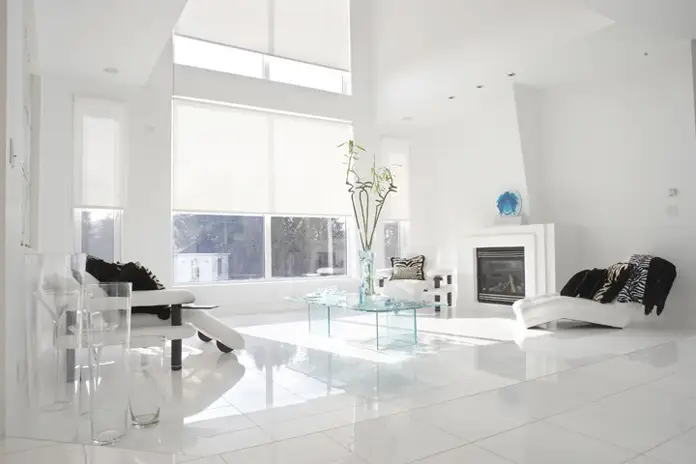 Custom light filtering shade in living room blocking bright sun